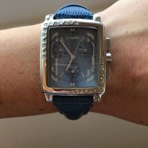 Diamond watch with blue band.